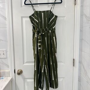 Green and white striped custom jumpsuit with adjustable straps and belt